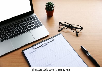 resume on wooden table in the modern office - Shutterstock ID 765841783