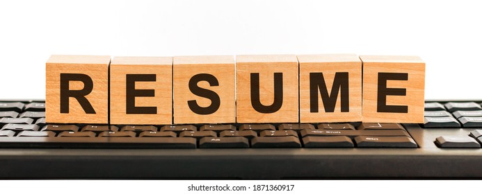 Resume - Word Made With Building Blocks. A Row Of Wooden Cubes With A Word Written In Black Font Is Located On A Black Keyboard.