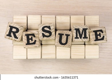 Resume Word Written On Wood Block On Beige Background