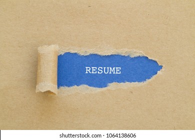 Resume Word Written Under Torn Paper.