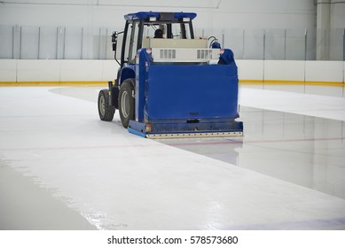 Resurfacing Machine Cleaning Ice Of Hockey Rink.