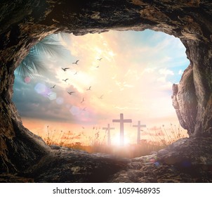 Resurrection of Easter Sunday concept: Empty tomb stone with three cross on meadow autumn sunrise background