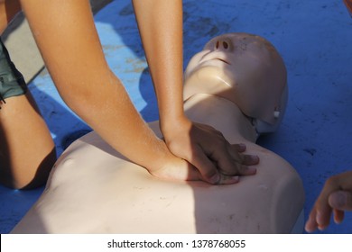 Resuscitation Technique On Dummy. First Aid Reanimation, CRP Training, Medicine, Healthcare And Medical Concept

