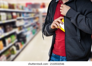 Retail Shoplifting. Man Stealing In Supermarket. Theft At Shop