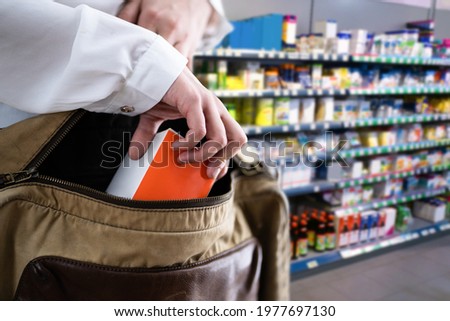 Retail Shoplifting. Woman Stealing In Supermarket. Theft At Shop