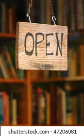 Retail And Shopping Image Of An Open Sign In A Book Store Window