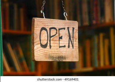 Retail And Shopping Image Of An Open Sign In A Book Store Window