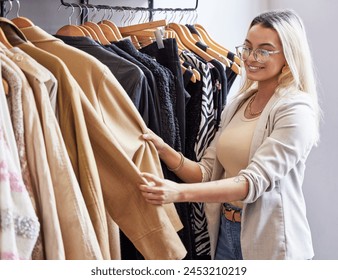 Retail store, woman and choose clothes with smile on sale, promotion and discount in boutique. Mall, female person or customer in San Francisco for shopping, outfit search and quality assurance - Powered by Shutterstock