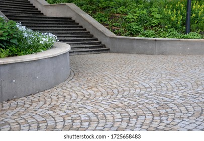 Retaining Wall At The Large Staircase In The Park The Flowerbed Area Is Planted With Rich Greenery Of Perennials Granite Paving Of Cubes