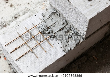 retaining wall and reinforcement construction from expanded clay blocks with stainless mesh