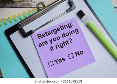Retargeting are you doing it right write on sticky notes isolated on Wooden Table. A person is answering question concept
