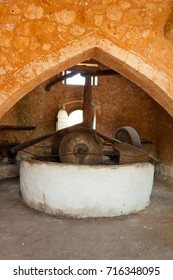 RETHYMNO, CRETE, GREECE — JULY 17, 2014: Traditional Greek Olive Oil Stone Press With A Millstone