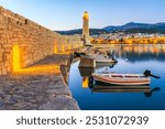 Rethymno, Greece. Idyllic city at Crete, Greek Islands. Morning view of the old venetian harbor and Venetian Fortezza Castle.