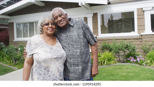 Retired African couple embracing each other on yard - Powered by Shutterstock