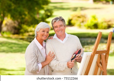 Retired couple painting in the park - Powered by Shutterstock