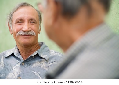 Retired Elderly People And Friendship, Two Old Men Meeting And Talking In City Park