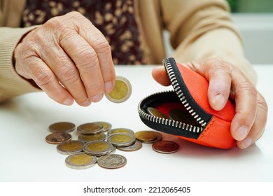 Retired Elderly Woman Counting Coins Money And Worry About Monthly Expenses And Treatment Fee Payment.