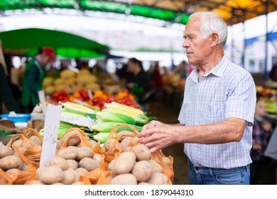 Retired European Man Buys Potatoes In Market