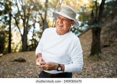 Retired Man Enjoying Music In The Middle Of The Forest