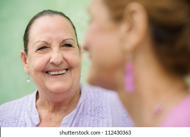 Retired old people and leisure activities, senior women talking in city park - Powered by Shutterstock