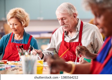 Retired Senior Man Attending Art Class In Community Centre