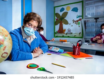 Retired Senior Woman Attending Class In Community Center, Wearing Face Mask. Keeping Social Distance In Classroom. Memory Exercises.