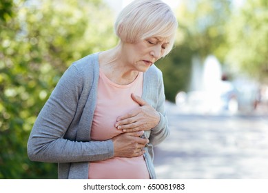 Retired Woman Having Heart Attack In The Park