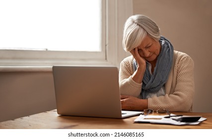 Retirement fund worries.... An elederly woman sitting in front of her laptop looking stressed and worried. - Shutterstock ID 2146085165