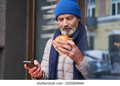 Retirement Guy Preparing Eating His Tasty Sandwich While Spending Time At The Cafe