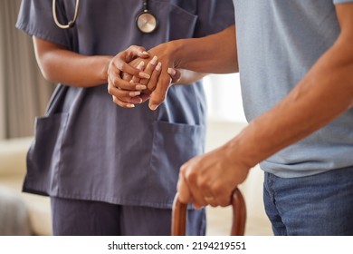 Retirement, Healthcare And Support With A Nurse And Senior Patient In An Old Age Home With A Walking Stick. Elderly Man And Medical Professional Walking And Holding Hands In Trust, Care And Help