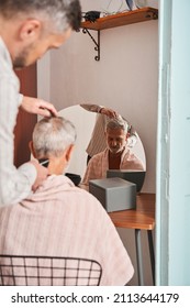 Retirement Man Getting Haircut At Home During Quarantine