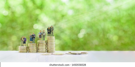 Retirement / pension or income tax and social security benefit concept : Four senior elder couple / greater aged person stand on steps or rows of rising coins, depicts preparing money for late life - Powered by Shutterstock