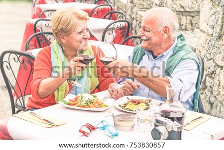 Similar – Mediterranean lunch or dinner with roasted dorado fishes, homemade focaccia bread , olive oil and olives served on rustic table with tableware and kitchen utensils, top view.