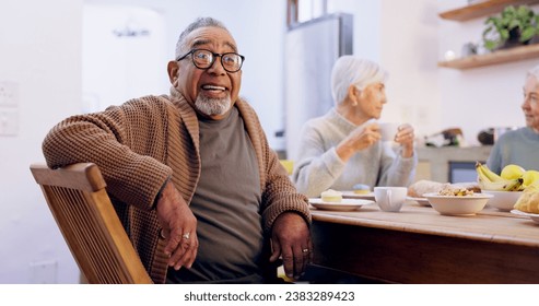 Retirement, tea party and a group of senior people in the living room of a community home for a social. Friends, smile or conversation with elderly men and women together in an apartment for a visit - Powered by Shutterstock