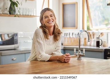 Retirement woman and relax in kitchen portrait with attractive and happy smile resting in house. Senior, elderly and positive lady in Canada home enjoying leisure break and pension lifestyle. - Powered by Shutterstock