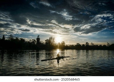 Retiro pond in Madrid at dawn with a canoeist doing sports - Powered by Shutterstock