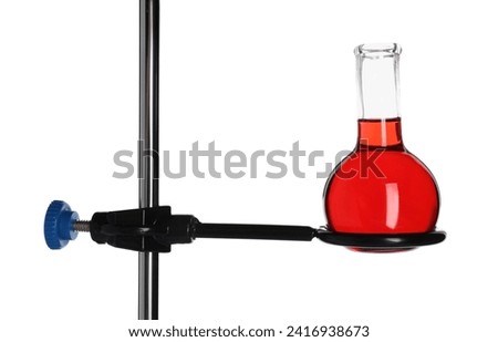 Retort stand with flask of red liquid isolated on white