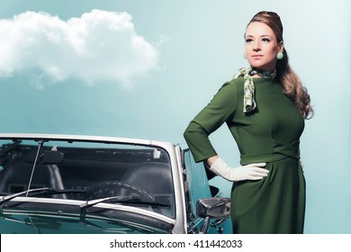 Retro 1960s Woman In Green Dress Standing Next Sportscar.