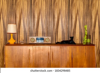 Retro 1970s cabinet with old radio, tiger statue, lamp and vases  - Shutterstock ID 1834298485