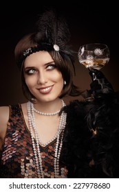 Retro 20s Style Woman Holding Champagne Glass - Portrait Of A Flapper Girl At A Party