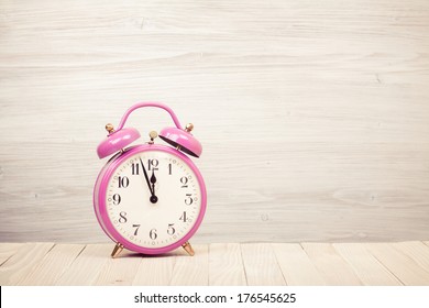 Retro Alarm Clock On Wooden Desk