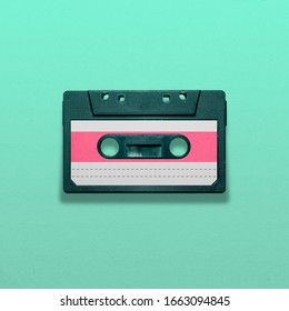 Retro audio cassette isolated on blue background, pop art design, close up