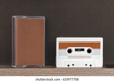 Retro audio tape and colorful cases isolated on black background - Shutterstock ID 633977708
