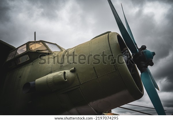 Retro\
aviation, grunge background. Old army\
airplane