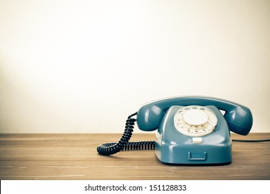 Retro Background With Rotary Telephone On Wood Table