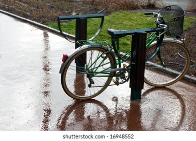 Retro bicycle left in the rain on the street - Powered by Shutterstock