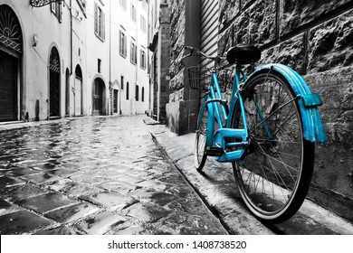 Retro blue bike on old town street. Color against black and white. Vintage style. Florence, Italy - Powered by Shutterstock