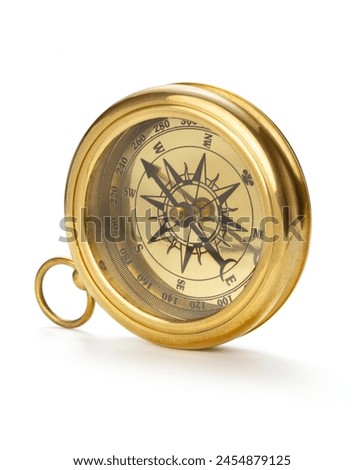 Retro brass compass on white background