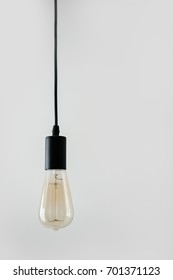 Retro Bulb On The Grey Background. Turned Off Electricity.