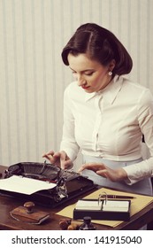 Retro Business Woman Typing In Her Office